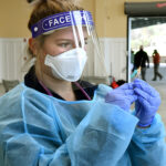 nursing student prepares vaccine
